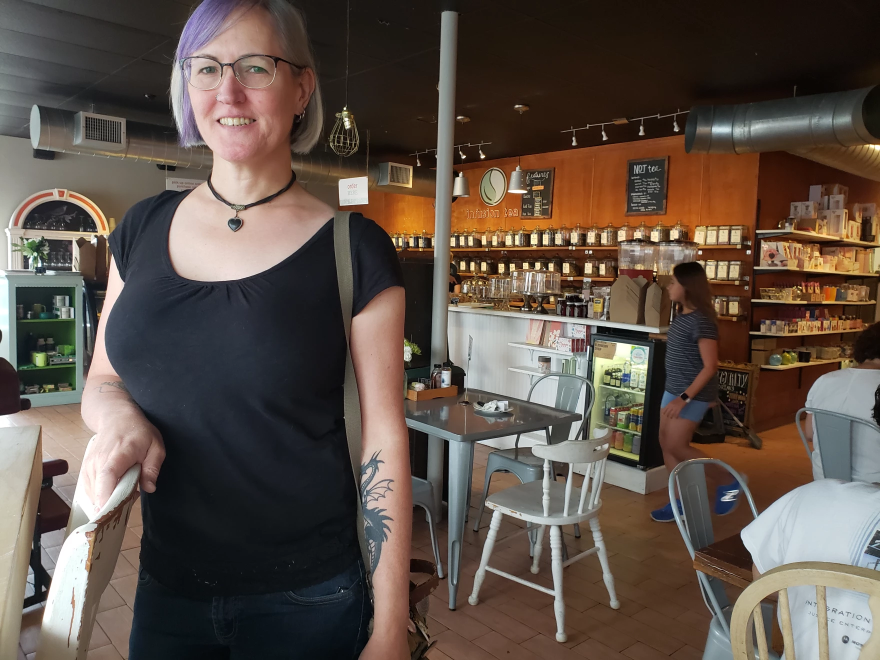 A woman wearing a black shirt.