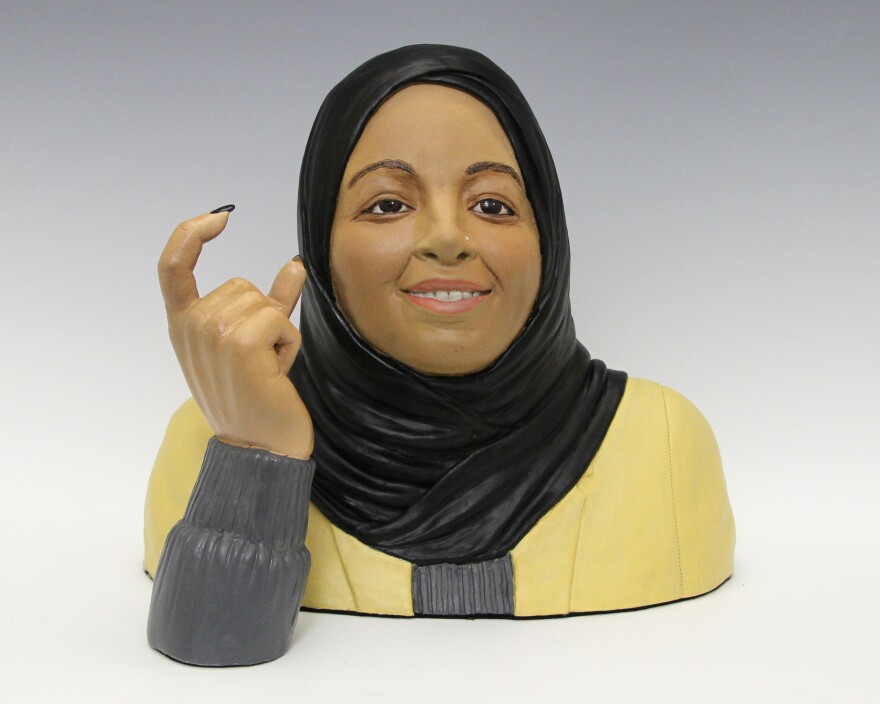 A sculptor of Minnesota Congresswoman Ilhan Omar signing in American Sign Language.