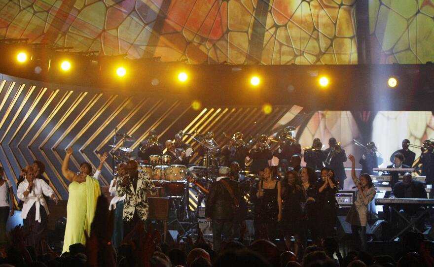 Aretha Franklin, left in yellow, on stage with The Clark Sisters at the 50th Grammy Awards in Los Angeles on February 10, 2008.