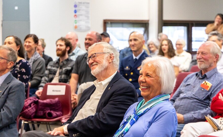 Gary and his wife Rita smile as various speakers share stories and memories about Stevens' decades of public service in Kodiak.