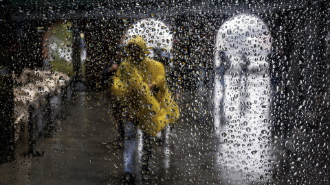 FILE: First Nor'Easter of the season hits the East Coast. People walk through Brooklyn in the rain as New York City experiences wind and rain associated with a nor’easter storm moving through the region on October 13, 2025 in New York City.