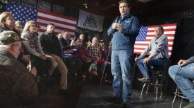 Republican presidential candidate Florida Gov. Ron DeSantis speaks during a campaign event at Wally's bar as Rep. Thomas Massie, R-Ky, right, watches, Wednesday, Jan. 17, 2024, in Hampton, N.H. 