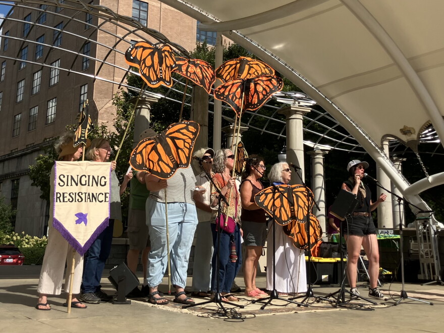 Members of the group Singing Resistance perform at a demonstration in Pack Square Park in Asheville Sunday, August 30, 2026.