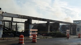 The burned wreckage of five Alpine businesses were left smoking on Monday morning after local firefighters fought the blaze overnight.