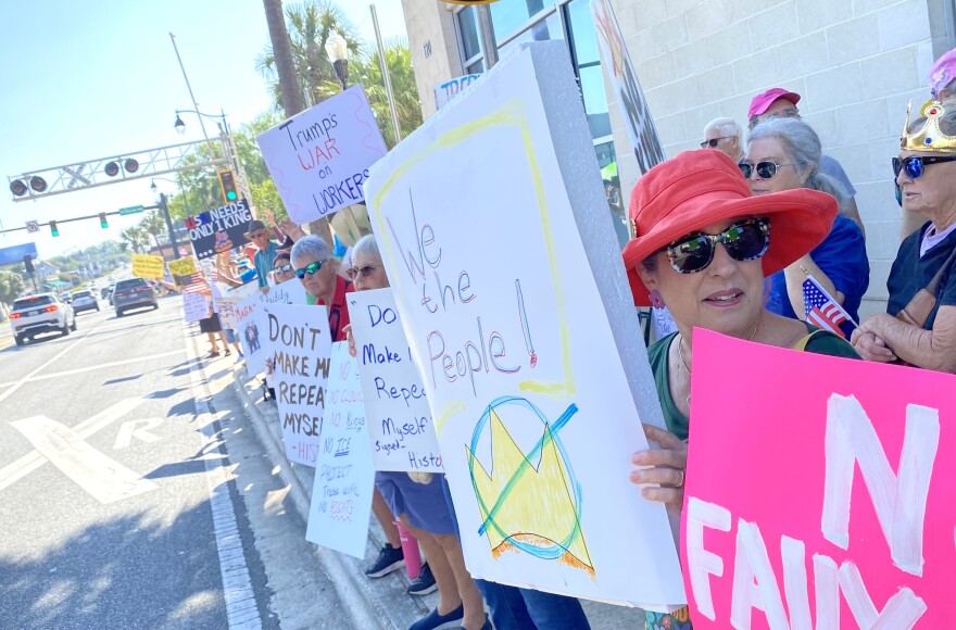 No Kings protesters lined both sides of Silver Springs Boulevard in downtown Ocala Saturday.