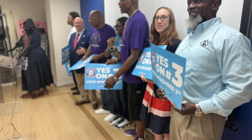 Kelvin Manurs, right, joins with Senator Elizabeth Bennett-Parker and other supporters of Amendment 3 at a press conference in Alexandria Tuesday.