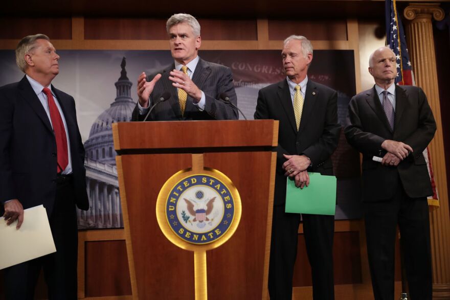 Sen. Lindsey Graham (from left), Sen. Bill Cassidy, Sen. Ron Johnson and Sen. John McCain, all Republicans, announced Thursday that they would not vote for a so-called skinny repeal of the Affordable Care Act without assurances from the House that the bill would go to conference.