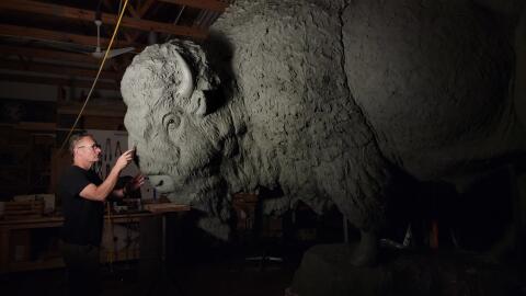 Wildlife artist Gary Staab prepares the bull bison sculpture in his studio.