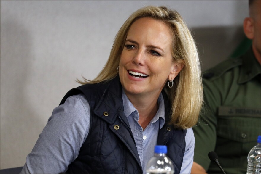 Homeland Security Secretary Kirstjen Nielsen listens to President Donald Trump at a roundtable on immigration and border security at the U.S. Border Patrol Calexico Station in Calexico, Calif., Friday April 5, 2019. 