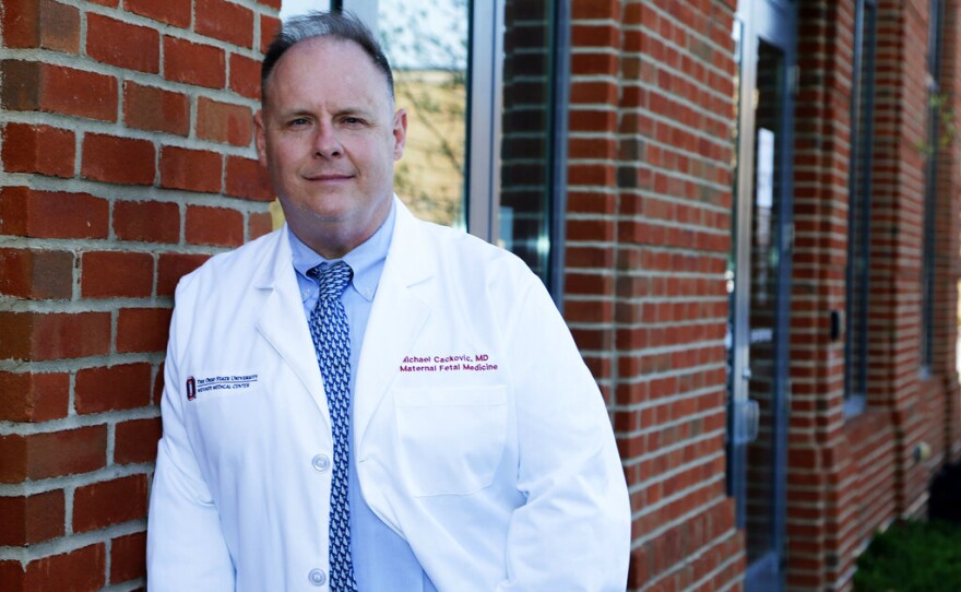 Dr. Michael Cackovic, an OB/GYN who works at Ohio State University’s Wexner Medical Center, stands outside the Ohio State Outpatient Care facility Friday, April 23, 2021, in Upper Arlington, Ohio. When Republican lawmakers across the U.S. kept passing bans on abortion at what they term “the first detectable fetal heartbeat,” he was exasperated. Yet bans pegged to the “fetal heartbeat” concept have been signed into law in 12 states, including Cackovic’s home state of Ohio, with another awaiting a governor’s signature. (AP Photo/Jay LaPrete)
