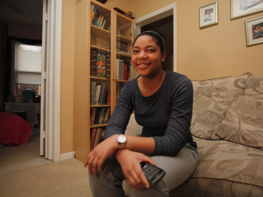 Khaliah Fitchette in her Newark home. (The cellphone she's holding is not the one she used to shoot video of officers).