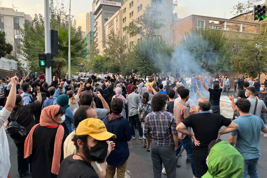 A picture obtained by AFP outside Iran shows people gathering in Tehran on Monday during a protest for Mahsa Amini, a woman who died after being arrested by the Islamic republic's morality police.