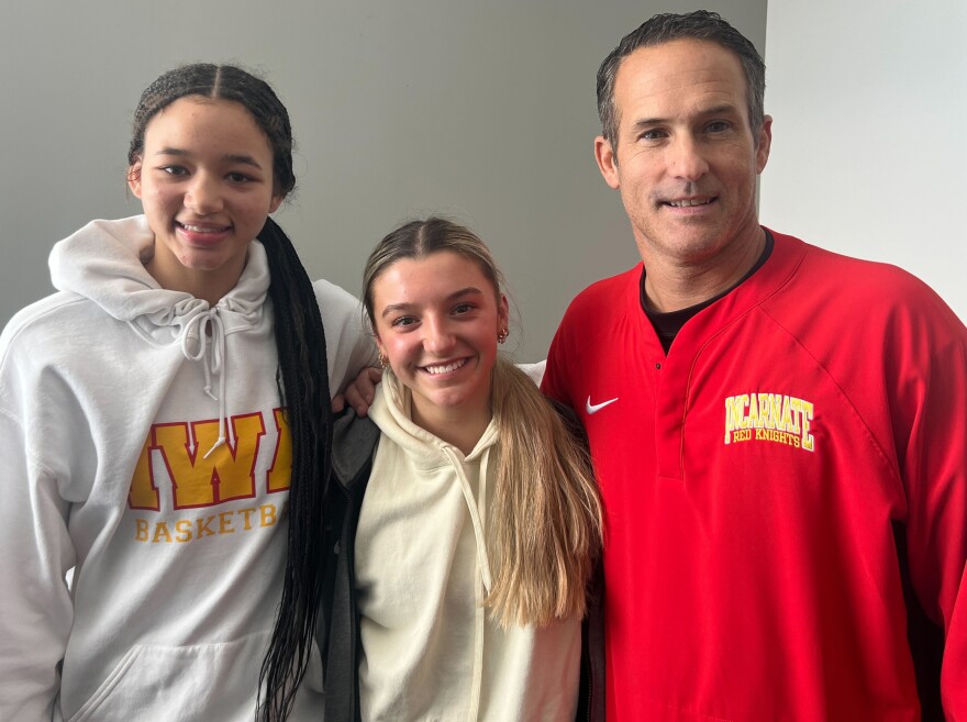 Guards Neveah Caffey, left, Addi Owens and Coach Dan Rolfes