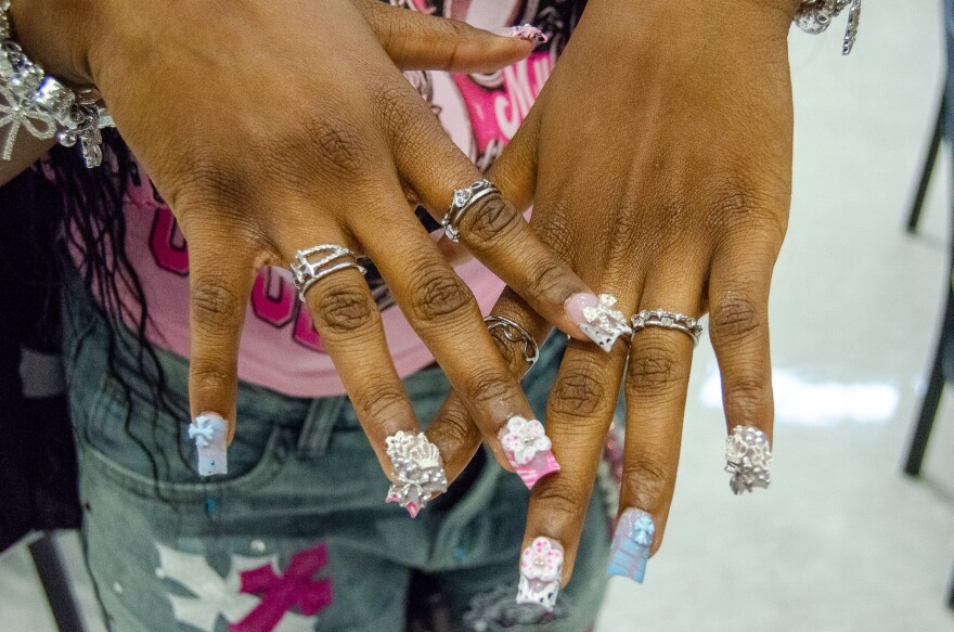 Sa'Niyah Mullins, a sophomore at Central High, matched her nails to her bedazzled jorts and wallet chain for her first day of class.