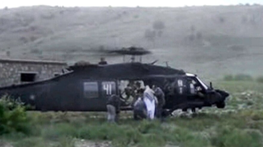 A video released by the Taliban shows Sgt. Bowe Bergdahl being bundled into a U.S. helicopter in eastern Afghanistan on Saturday.