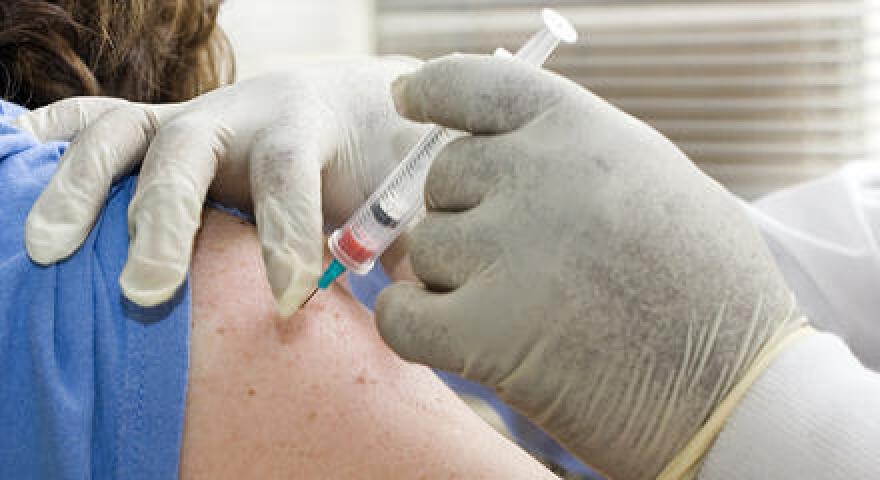 vaccine shot into arm 