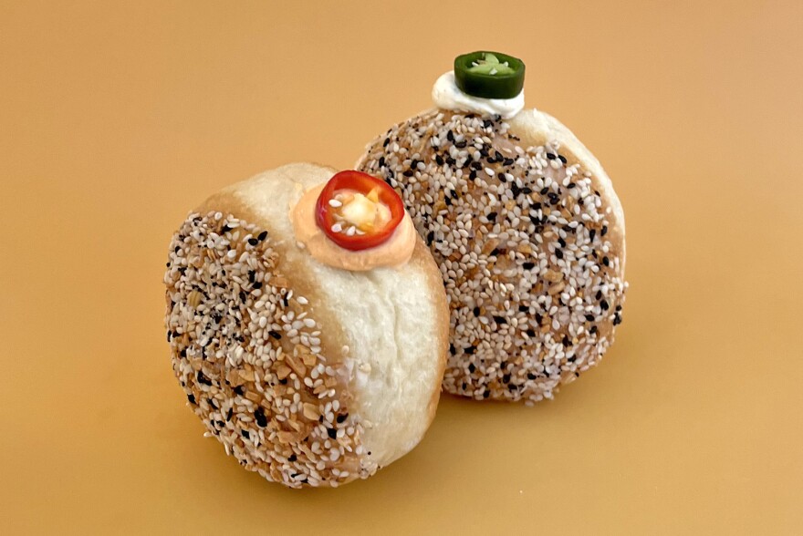 Slow Rise donuts featuring Jalapeno Cheddar and Jimmy Nordello peppers with whipped chevre, coated with Everything Bagel seasoning.