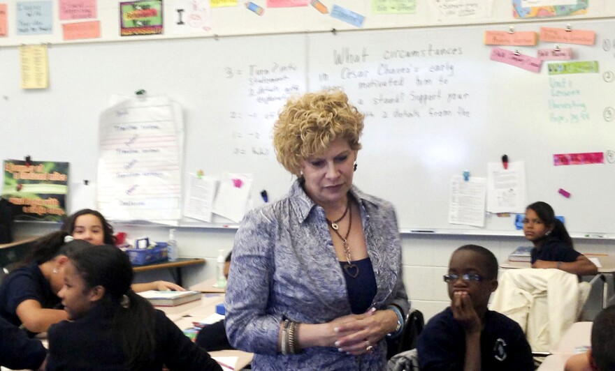 Julia de Burgos Elementary teacher Gail Kantor, shown here in her sixth-grade class, says she buys things like clothing, books and school supplies for her students with her own money. "Some kids don't ever have a dime," she says.