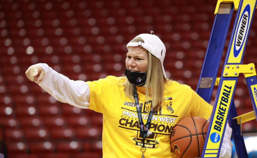 Associate Head Coach Heather Ezell celebrating after the championship win.