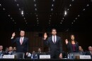 Acting Director of the Bureau of Alcohol, Tobacco, Firearms and Explosives Thomas Brandon (from left), Acting Deputy FBI Director David Bowdich and U.S. Secret Service's National Threat Assessment Center head Lina Alathari are sworn in before testifying to the Senate Judiciary Committee on Wednesday.