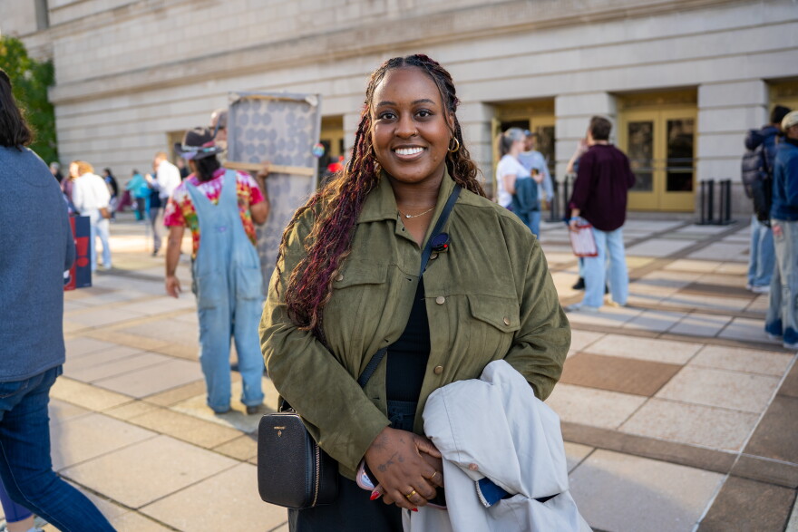 Woman stands outside Public Auditorium in Cleveland.