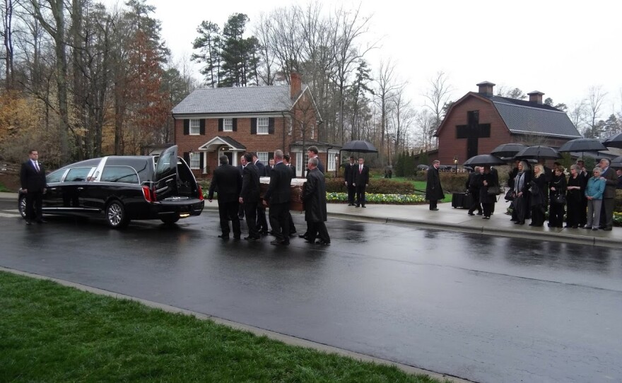 Pallbearers move Billy Graham's casket from a hearse to the Billy Graham Library on Thursday. 