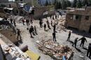 Journalists from foreign media based in Tehran document damage from U.S.-Israeli strikes in a residential area of the town of Fardis, west of Tehran, Iran, Friday, April 3, 2026. (Vahid Salemi/AP)