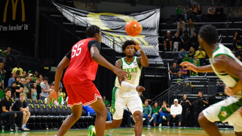 Oregon power forward Pharaoh Compton passes the ball over Seattle U center Halvine Dzellat in an exhibition game on Oct. 15, 2026 at Matthew Knight Arena in Eugene. Compton scored the most points for Oregon with 15 in the game.