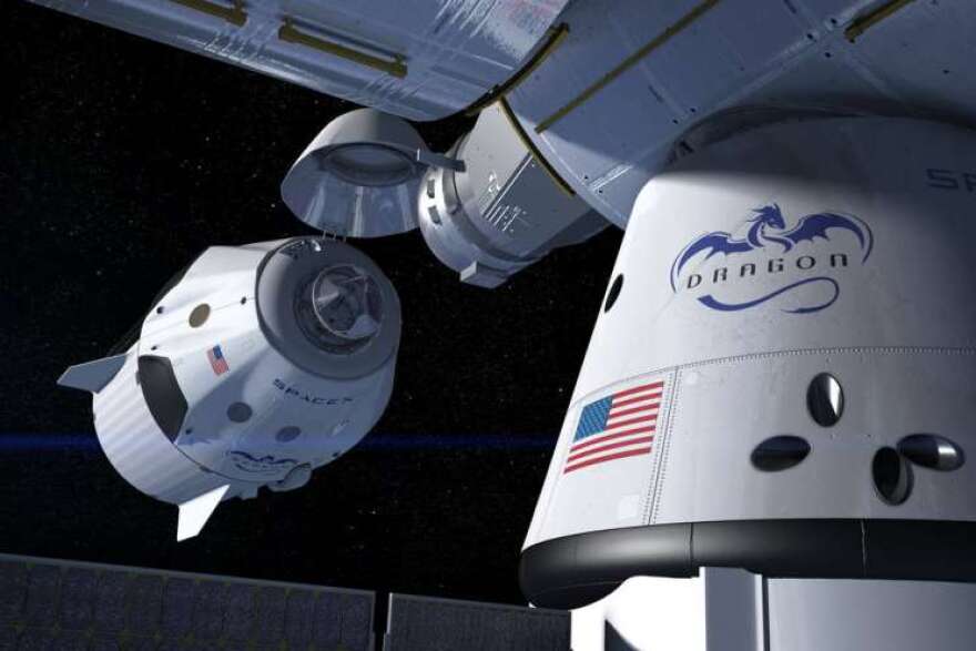 This artist's concept shows a SpaceX Crew Dragon docking with the International Space Station, as it will during a mission for NASA's Commercial Crew Program. NASA is partnering with Boeing and SpaceX to build a new generation of human-rated spacecraft capable of taking astronauts to the station and back to Earth, thereby expanding research opportunities in orbit.Photo: SpaceX