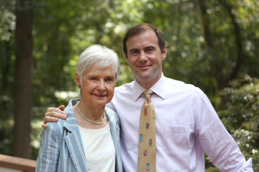 Maureen Scalia and her son Christopher stand on the back porch of the family's home in Virginia.