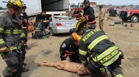 Sedgwick County firefighters work on mannequins as part of advanced training to prepare for accidents and medical emergencies.