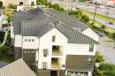 Swimming pool spa in new development apartment complex with metal roofing, siding near Interstate Highway I-35, fast growing area Pflugerville northeast of downtown Austin, Texas, housing marke