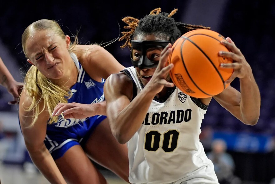 FILE, Colorado guard Jaylyn Sherrod (00) gets past Drake guard Katie Dinnebier (10) during the second half of a first-round college basketball game in the women’s NCAA Tournament in Manhattan, Kan., Friday, March 22, 2024, in Manhattan, Kan. Colorado won 86-72.