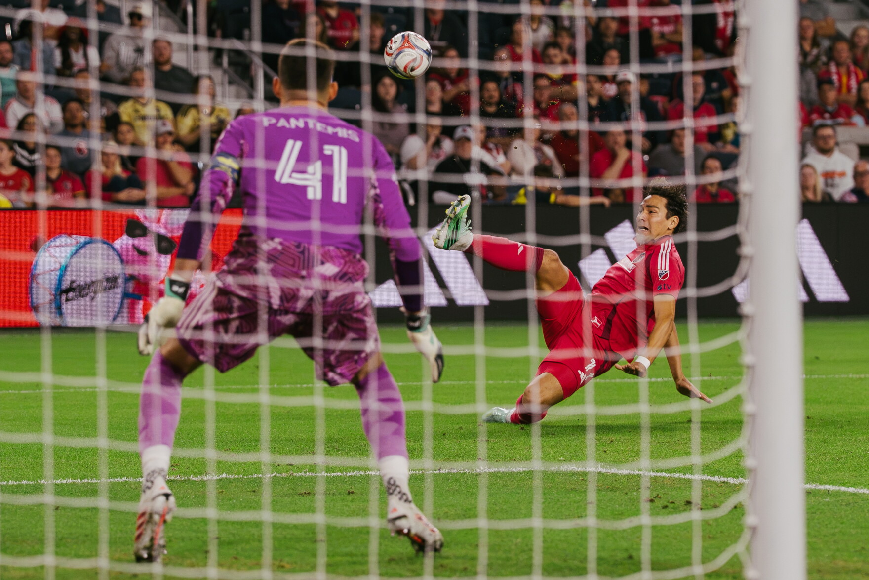 St. Louis City SC forward Simon Becher (#11) attempts an acrobatic shot on goal in front of Portland Timbers goalkeeper James Pantemis (#41) during their match at Energizer Park on Wednesday, Oct. 28, 2026, in St. Louis’ Downtown West neighborhood.