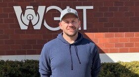 man standing in front of building