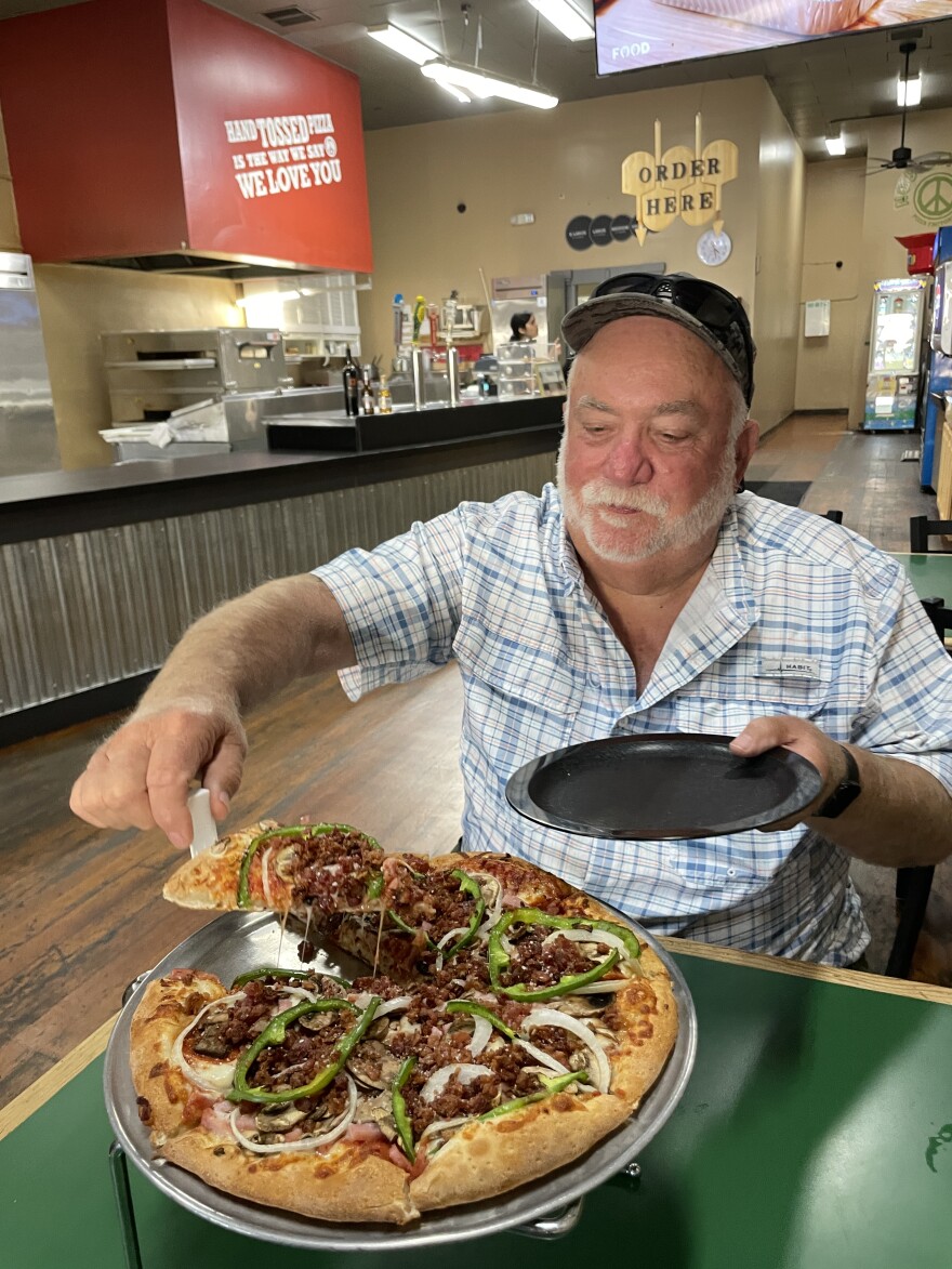 Steve Leutholtz enjoys a Humphrey Special off menu at the Pizza Factory in Rio Vista, CA.
