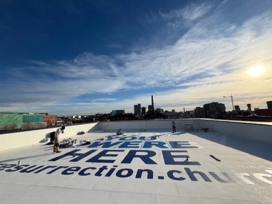 The United Methodist Church of the Resurrection has splashed a large welcome sign for World Cup athletes and fans on the roof of its campus in downtown Kansas City. It can be seen from airplanes and from nearby tall buildings and is part of the way this 10-campus church is readying for this summer’s World Cup competition in Kansas City.
