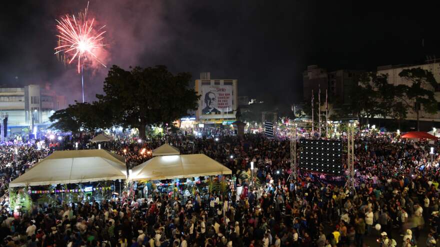 Fireworks go off as Catholic faithful watch a televised screening of the ceremony of the canonization of martyred archbishop Oscar Romero at Gerardo Barrios Square in San Salvador on Sunday.