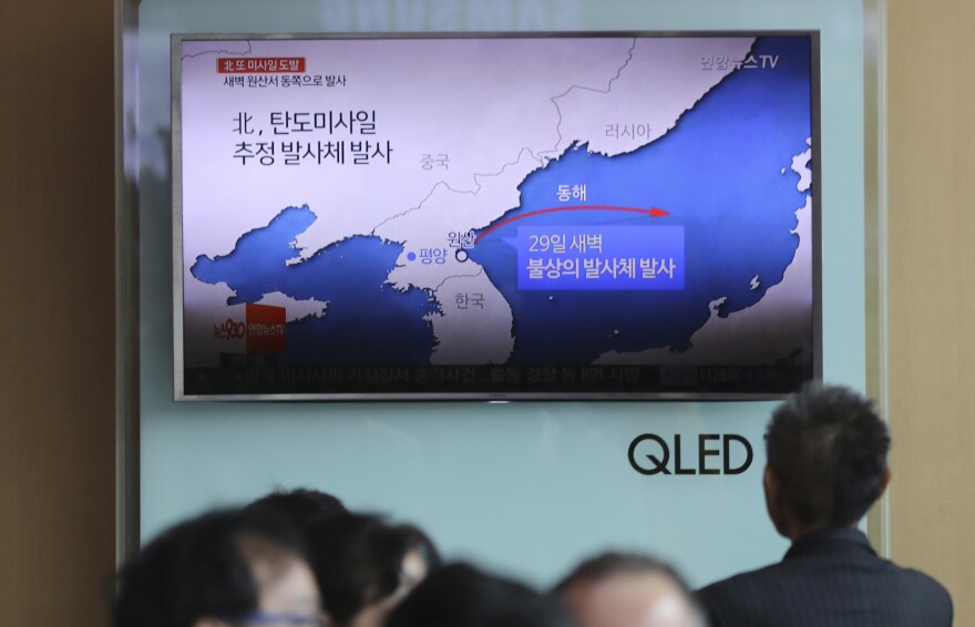 The news of North Korea's missile firing is broadcast at Seoul Train Station in South Korea on Monday.