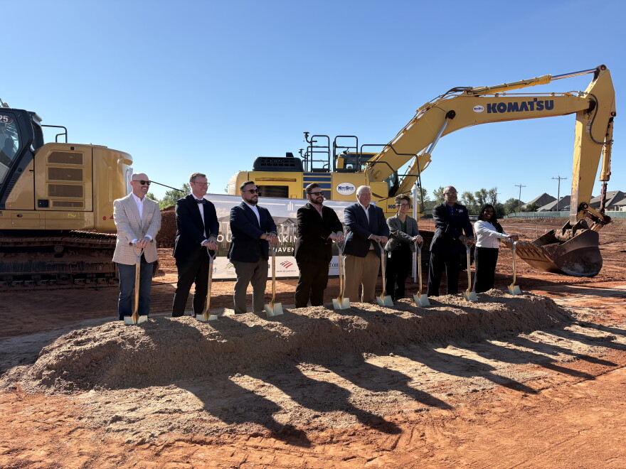 Representatives from the Oklahoma City Housing Authority and development company Elmington pose at a groundbreaking ceremony for West Haven Flats, a new workforce housing project in west Oklahoma City.