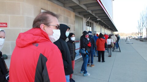 Columbus residents line up for their COVID-19 vaccination at St. John Arena on Ohio State's campus on March 19, 2021.