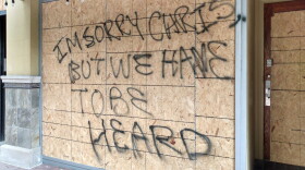 Protesters left a message for the owner of Jack's Donuts in Indianapolis after the clashes with police in June 2020.