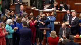 two people hug in a crowd