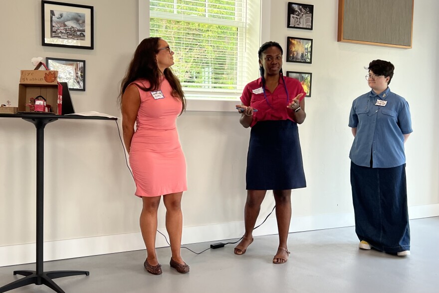 Wandy Pascoal, center, of the Boston Society of Architects, speaks at an event in Harwich highlighting the adaptive reuse of the Old Bank Street Firehouse, July 16, 2026.