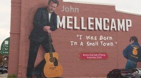 Mural artist Pamela Bliss says Mellencamp glorified Seymour as America’s “small town” in his iconic 1985 single.