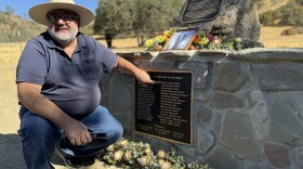 Luis Carlos Estrada Andrade points to the name of his grandfather, Rosalío Estrada Padilla, who died in the 1948 plane crash near Coalinga.