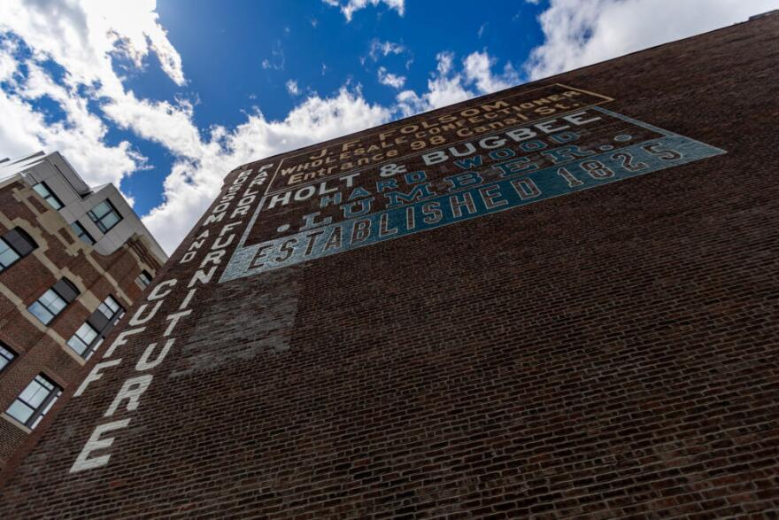 The restored Holt &amp; Bugbee lumber company sign in the West End of Boston. (Jesse Costa/WBUR)