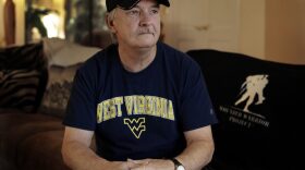 Mike Baughman sits for a photo at his home in Danville, Calif., on Tuesday, Aug. 2, 2016. The 64-year-old is among hundreds of veterans who have been diagnosed with cholangiocarcinoma, a rare form of bile duct cancer that may be linked to their time in the service and an unexpected source: parasites in raw or poorly cooked river fish. (Ben Margot/AP)
