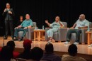 Fort Wayne Police Chief Scott Caudil, Mayor Sharon Tucker and Roderick Parker of Big Hearts Community Projects sit on the stage in the Allen County Public Library theater on Wednesday. The three, along with Unity Barbershop's Foundation One discussed places where the city has improved in safety and how to address youth on a path to violence.
