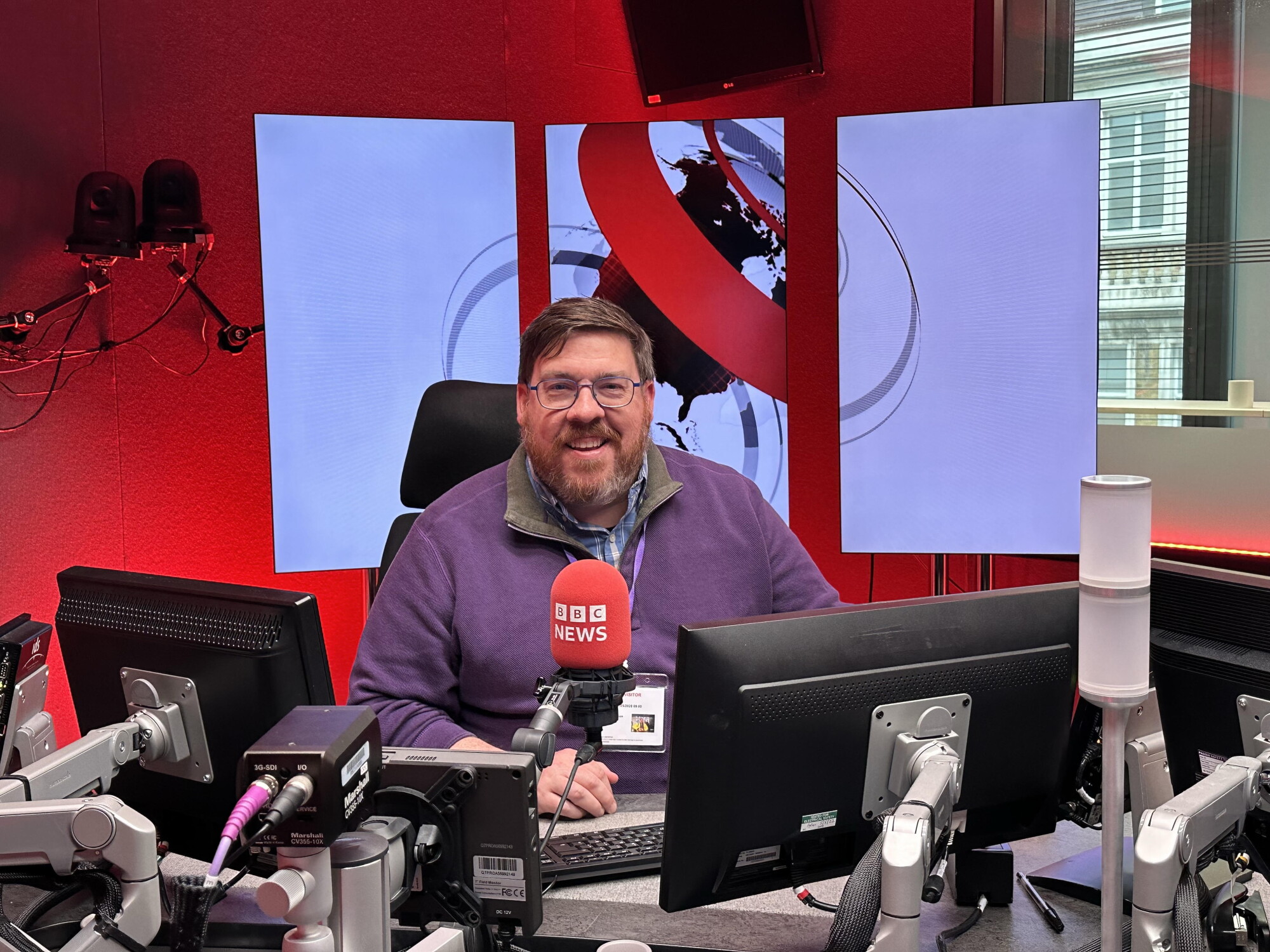 Ed Ronco (in London) with the BBC's James Coomarasamy episode artwork